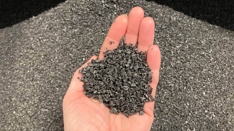 hand holding PE granulate