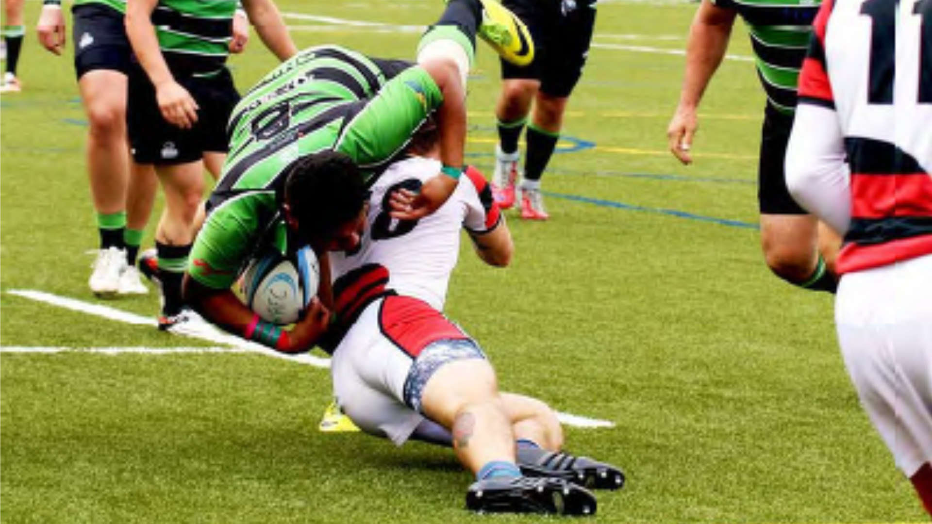 Rugby players tackling - Woodlands rugby